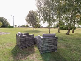 Chairs and table in a garden at The Annexe Litcham