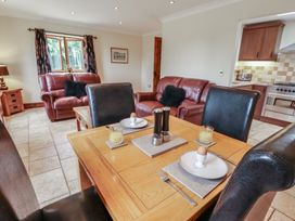A dining room with a table and chairs at The Annexe in Litcham