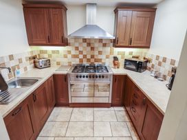 A kitchen featuring cabinets and appliances at The Annexe Litcham