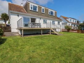 A house with a deck in the garden at Treverrion in Gorran Haven