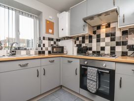A kitchen with a sink and oven at Fortunatus in Whitby