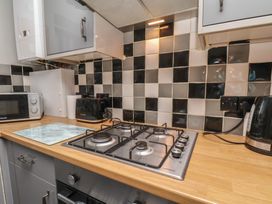 A kitchen with a gas hob and appliances at Fortunatus in Whitby