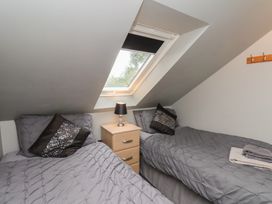 A bedroom with two beds and a window at Fortunatus in Whitby