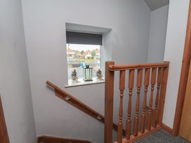 A staircase with a window and lantern at Fortunatus in Whitby