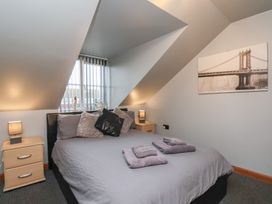 A bedroom with a bed and pillows at Fortunatus in Whitby