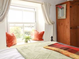 A bedroom with a window and a bed at Longview Cottage Penwithick neat St Austell