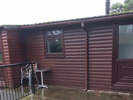 An outdoor area with a table and chairs at Snowdrop in Saltburn-by-the-Sea