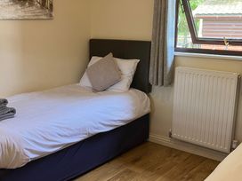A bedroom with a single bed and a window at Snowdrop in Saltburn-by-the-Sea