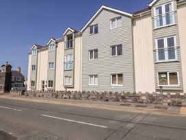A building with multiple windows and a clock tower at Maelog, 14 Tides Reach, Rhosneigr