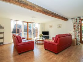 A living room with sofas and a coffee table at The Wainhouse in Bockleton near Tenbury Wells
