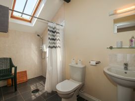 A bathroom with a shower, toilet, and sink at The Wainhouse in Bockleton near Tenbury Wells