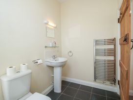 A bathroom with a toilet and sink at The Wainhouse in Bockleton near Tenbury Wells