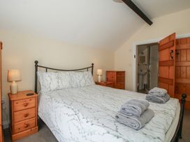A bedroom with a bed and bedside tables at The Wainhouse in Bockleton near Tenbury Wells