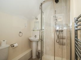 A bathroom with a shower and a washbasin at The Wainhouse in Bockleton near Tenbury Wells
