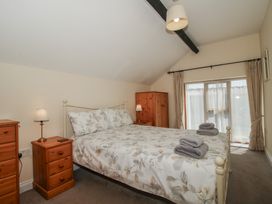 A bedroom with a bed and bedside tables at The Wainhouse in Bockleton near Tenbury Wells