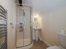 A bathroom with a shower, sink, and toilet at The Wainhouse in Bockleton near Tenbury Wells