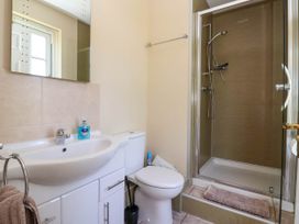 A bathroom with a sink, toilet, and shower enclosure at Foremans House in Bridlington