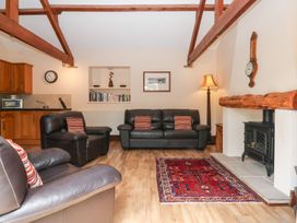 A living room with sofas and a fireplace at Winsall Court I Gransmoor near Bridlington