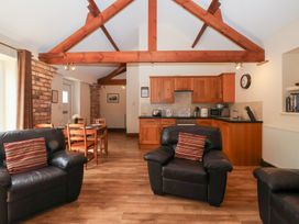 A living room with kitchen area at Winsall Court I Gransmoor near Bridlington