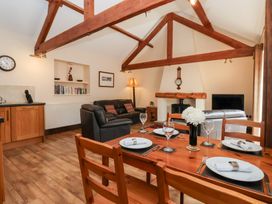 A living room with a dining area and kitchen at Winsall Court I Gransmoor near Bridlington