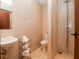 A bathroom with a shower and sink at Winsall Court I Gransmoor near Bridlington