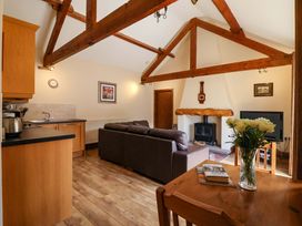 A living room with a sofa and coffee table at Winsall Court II in Gransmoor near Bridlington