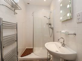 A bathroom with a shower and sink at The Wagon Shed in Gransmoor near Bridlington