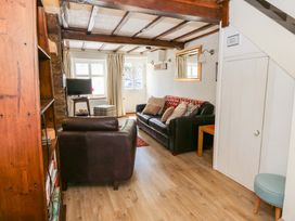 A living room with sofa and coffee table at Chancery Cottage Hay-On-Wye