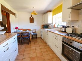 A kitchen with dining area at Chancery Cottage Hay-On-Wye