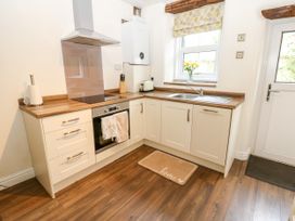 A kitchen with a sink and oven at 27 Bongate, Appleby-In-Westmorland