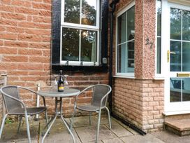 A table with chairs and a bottle on it at 27 Bongate in Appleby-In-Westmorland