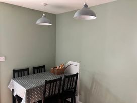 A dining room with a table and chairs at Silver Birch House in Beaufort Killarney, County Kerry