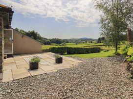 An outdoor area with a patio and view of the landscape at Acorn in Bowness-on-Windermere