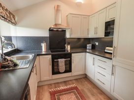 A kitchen with modern appliances at Acorn in Bowness-on-Windermere