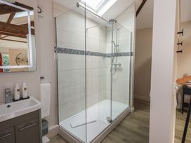 A bathroom with a shower and sink at Acorn in Bowness-on-Windermere