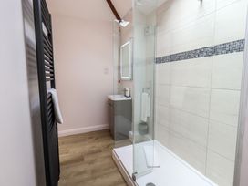 A bathroom with a shower and sink at Acorn in Bowness-on-Windermere