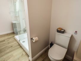 A bathroom with a shower and toilet at Acorn in Bowness-on-Windermere