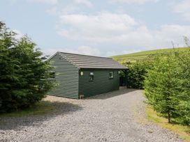 A cabin surrounded by trees at Ash Lodge Pennington near Ulverston