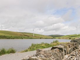 A landscape with wind turbines and a lake at Ash Lodge Pennington near Ulverston