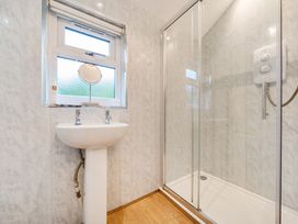 A bathroom with a shower and sink at Ash Lodge Pennington near Ulverston