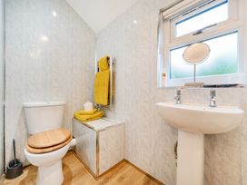 A bathroom with a toilet and sink at Ash Lodge in Pennington near Ulverston