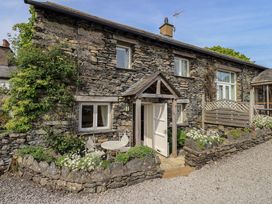 An outdoor view of a stone cottage entrance at Kestrel Cottage near Cartmel