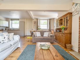 A living room with a sofa and coffee table at East Wing in Crewkerne