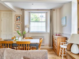 A dining room with a table and chairs at East Wing in Crewkerne