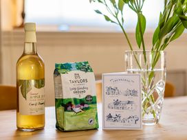 A kitchen with apple juice, coffee, and a greeting card at East Wing Crewkerne