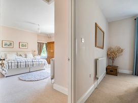 A bedroom with a bed and furniture at East Wing in Crewkerne
