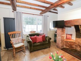 A living room with a sofa and a rocking chair at Town Mill in Bewdley