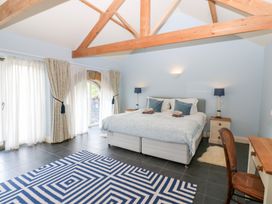 A bedroom with a bed and side tables at Gallow Law Cottage Bellingham