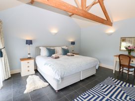 A bedroom with a bed and nightstands at Gallow Law Cottage Bellingham