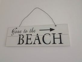 A sign that says gone to the beach at Keepers Cottage Sidmouth